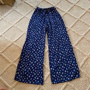 Royal blue flowy pants with white flowers. Size medium.